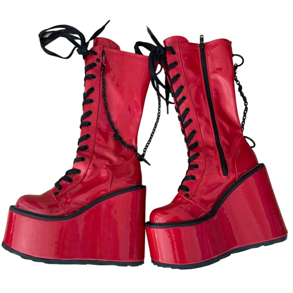 Demonia red faux leather lace-up platform boots with chain detailing and 7" heel